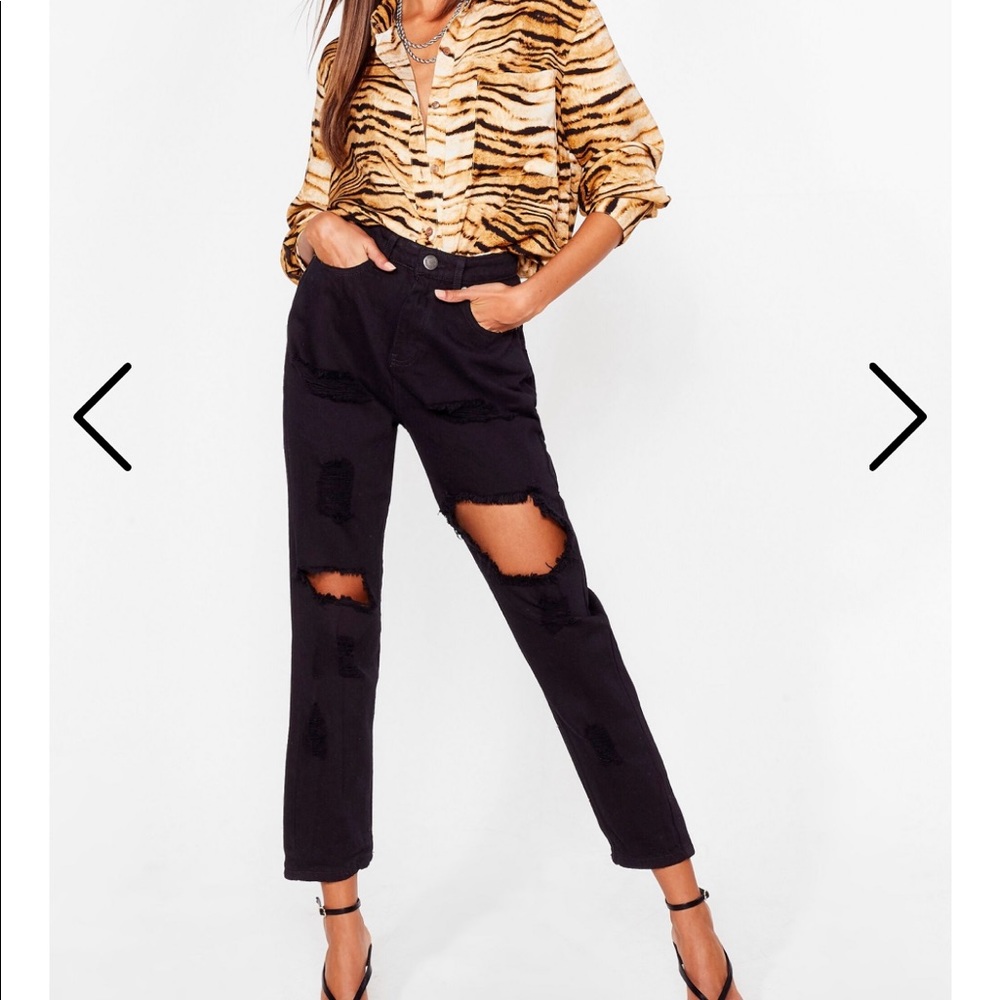 Black relaxed fit jeans. Ripped